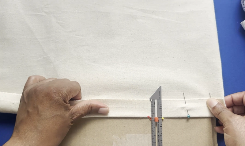 The pinned sewing gauge acts like a reliable little guide